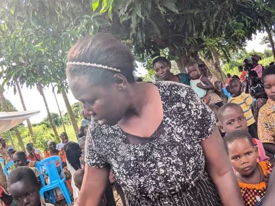 A volunteer reaching out to a family with support