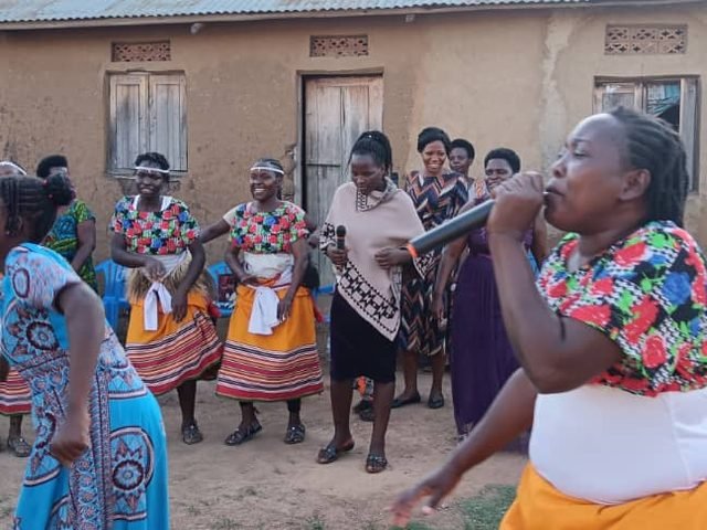 Dance troupe performing traditional dress on stage