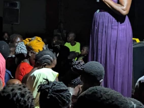 An evening stage performance to a large crowd