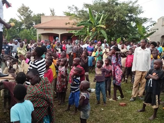 A large crowd of children and families gathered together