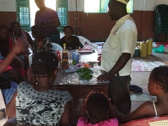 A cooking demonstration with fresh ingredients