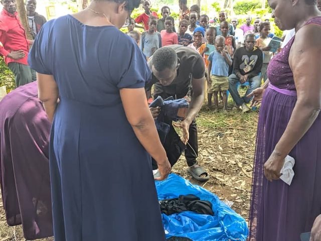 Women distributing donated items to families