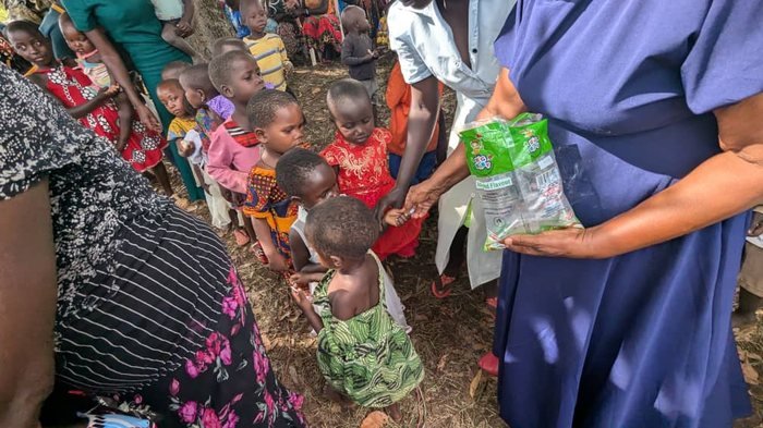 Children from our community programs, gathered close together