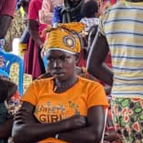 A woman celebrating with the Turikumwe community