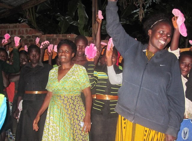 Girls celebrating a sanitary pad distribution drive