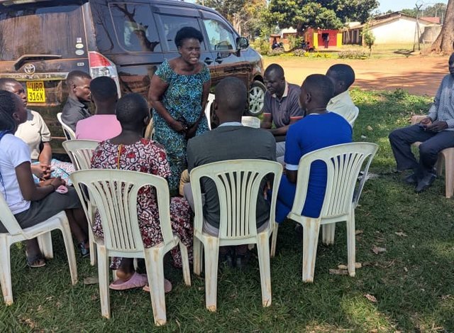 A savings and business training circle meeting outdoors