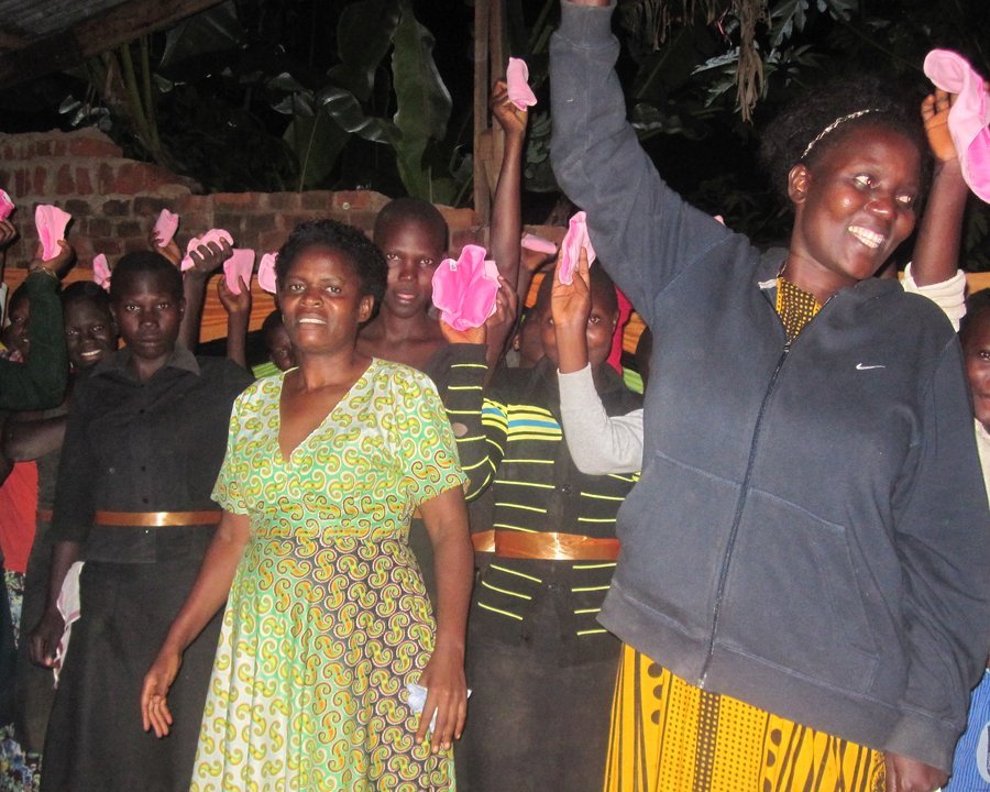 Girls and women celebrating a pad distribution drive